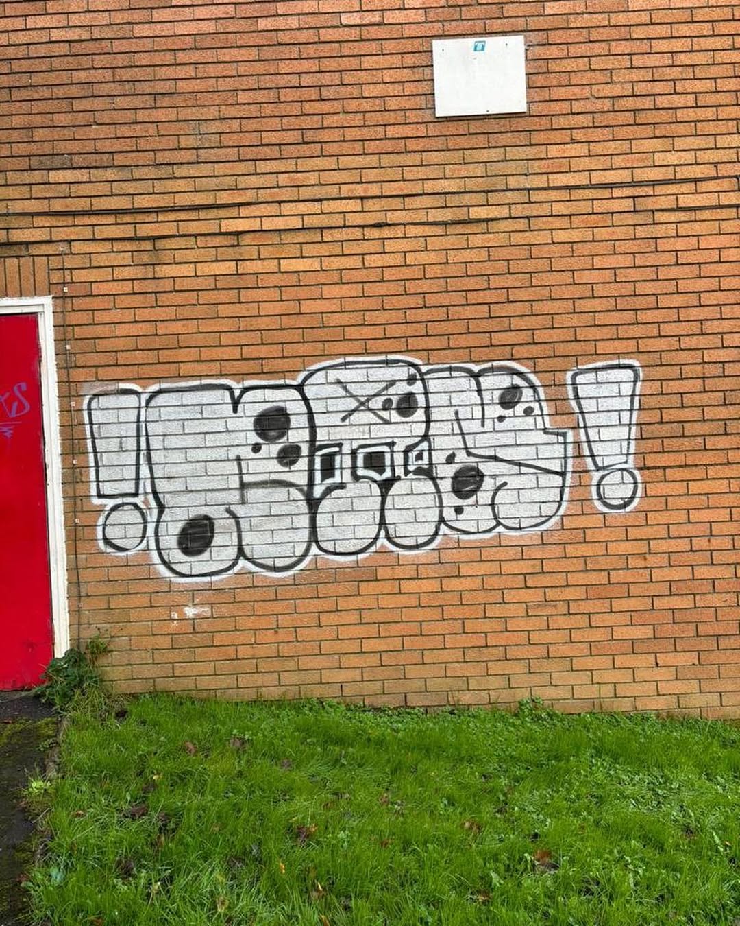 Graffiti on brick wall